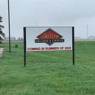 Sign in front of new location, 160 Industrial Parkway.